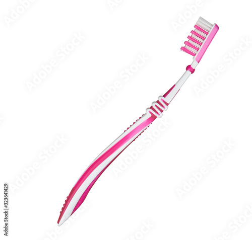 pink plastic toothbrush sideways isolated on white photo