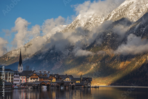 Hallstatt, a charming village on the Hallstattersee lake and a famous tourist attraction, with beautiful mountains surrounding it, in Salzkammergut region, Austria, in winter sunny day. © Aron M  - Austria
