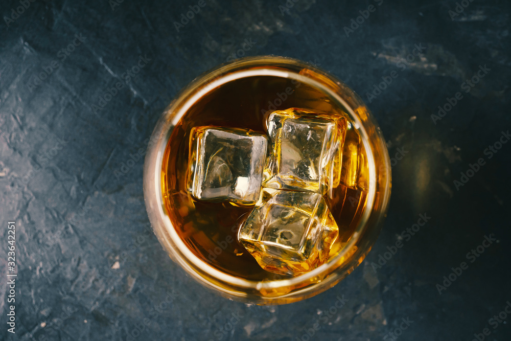 Whiskey with ice in a classic glass. View from above