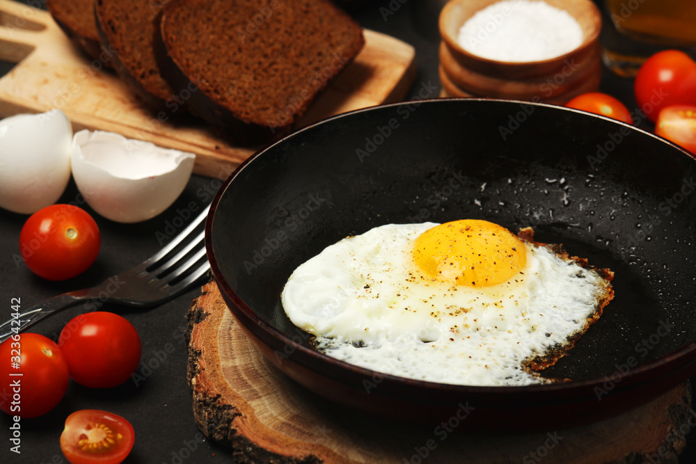 Fried egg with tomatoes and bread Fried egg with tomatoes and bread