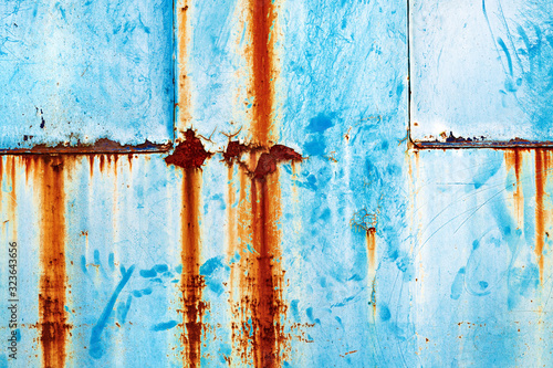 Grunge rusty metal surface painted in blue