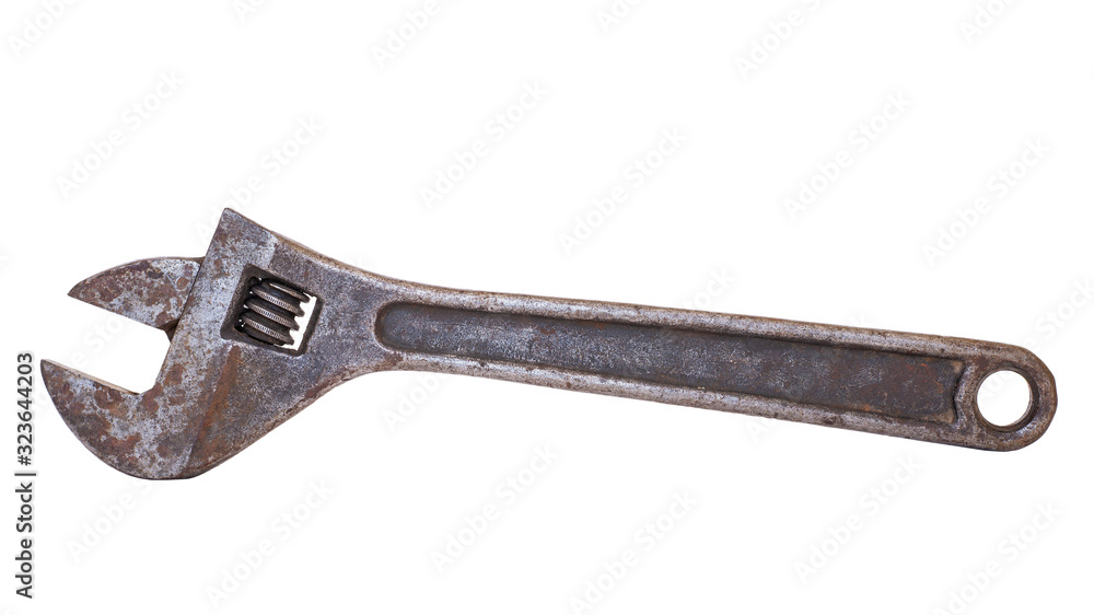 Old adjustable wrench on a white background close-up. Isolate. Old adjustable wrench on a white background close-up. Isolate.