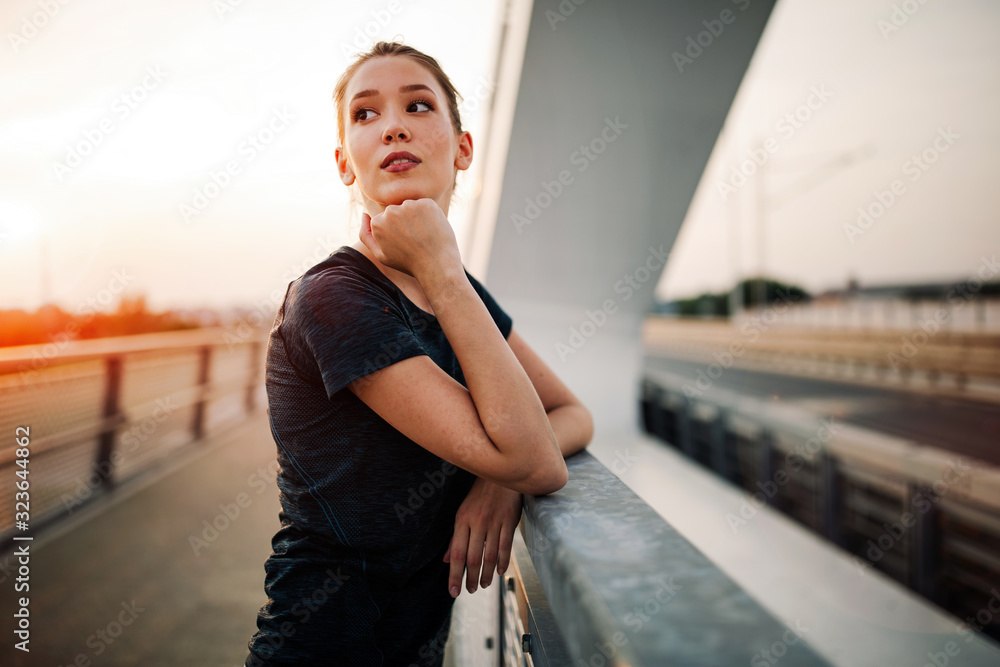 Portrait of woman taking break from running