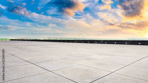 Wide square floor and city suburb skyline at sunset in Shanghai,panoramic view.