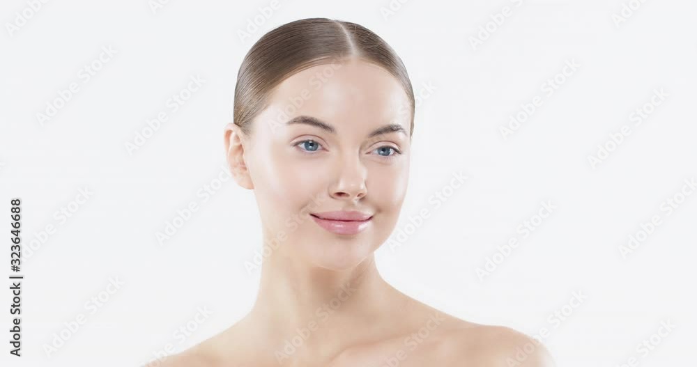 Beauty woman face with blue eyes looking at camera, isolated on white background. Beautiful female model with perfect clean fresh skin. Skin care treatment or cosmetic ads concept Beauty woman face with blue eyes looking at camera, isolated on white background. Beautiful female model with perfect clean fresh skin. Skin care treatment or cosmetic ads concept
