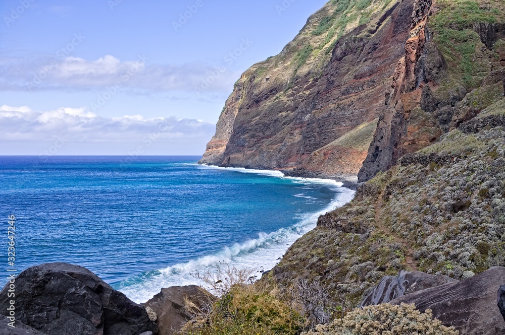 Panoramic view of the cliffs on Atlantic Ocean's bay (Madeira, Portugal, Europe)
