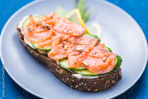 Sandwich with smoked salmon and cucumber. Concept for healthy nutrition.