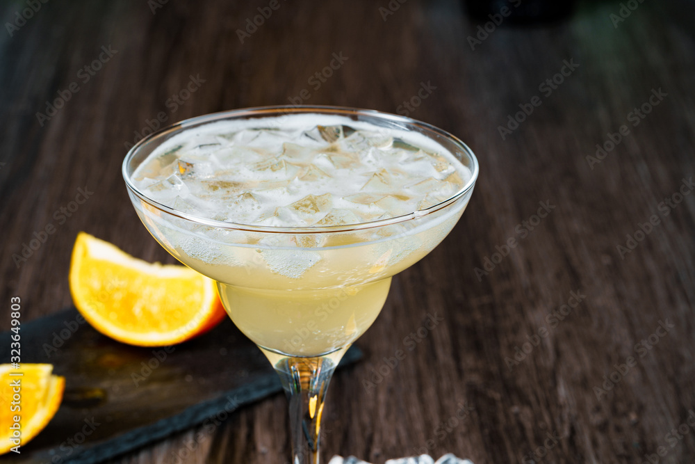 Alcoholic coktail served with orange slice close up Alcoholic coktail served with orange slice close up