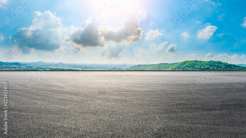 Wide race track and city suburb skyline on a sunny day in Shanghai,panoramic view. © ABCDstock