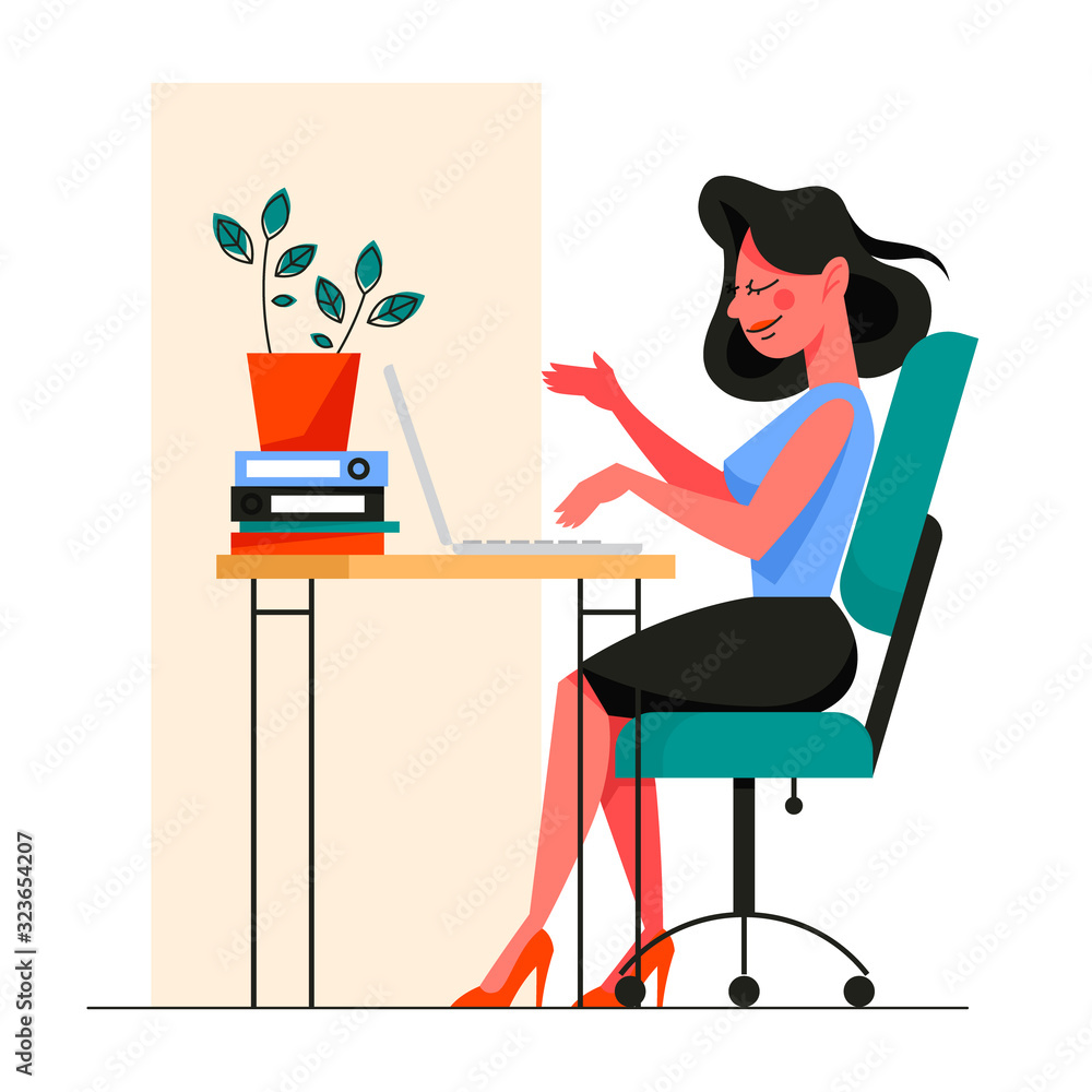 Woman in smart casual sitting at the desk and working on the computer Woman in smart casual sitting at the desk and working on the computer