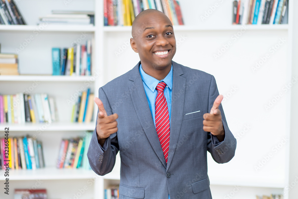Laughing african american businessman with suit