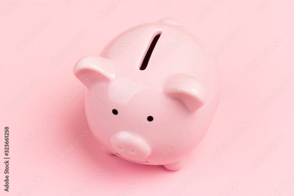 pink ceramic piggy Bank isolated on pink background