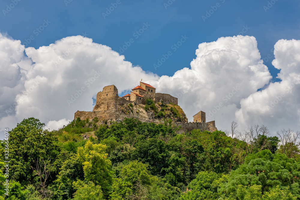 Beautiful view of the Rupea Stronghold Fortress on a blue sky with white clouds, Rupea, Brasov, Romania
