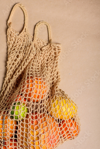 Fresh lemon, oranges, grapefruit and lime in string bag.