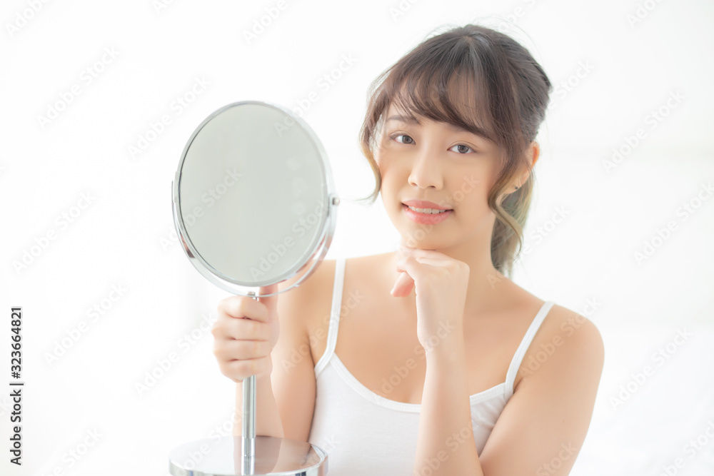 Beautiful face young asian woman with happy smiling and looking mirror, makeup of beauty facial girl with skincare and cosmetic treatment, refresh of female and clean for charming, healthy concept. Beautiful face young asian woman with happy smiling and looking mirror, makeup of beauty facial girl with skincare and cosmetic treatment, refresh of female and clean for charming, healthy concept.