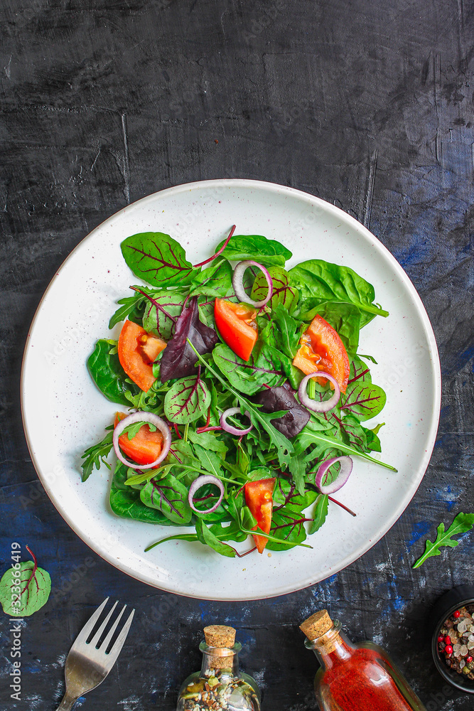 Healthy salad, leaves mix salad (mix micro greens, cucumber, tomato, onion, other ingredients). food background. copy space Healthy salad, leaves mix salad (mix micro greens, cucumber, tomato, onion, other ingredients). food background. copy space