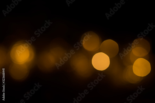 Abstract dark background with golden bokeh © viktoriya89