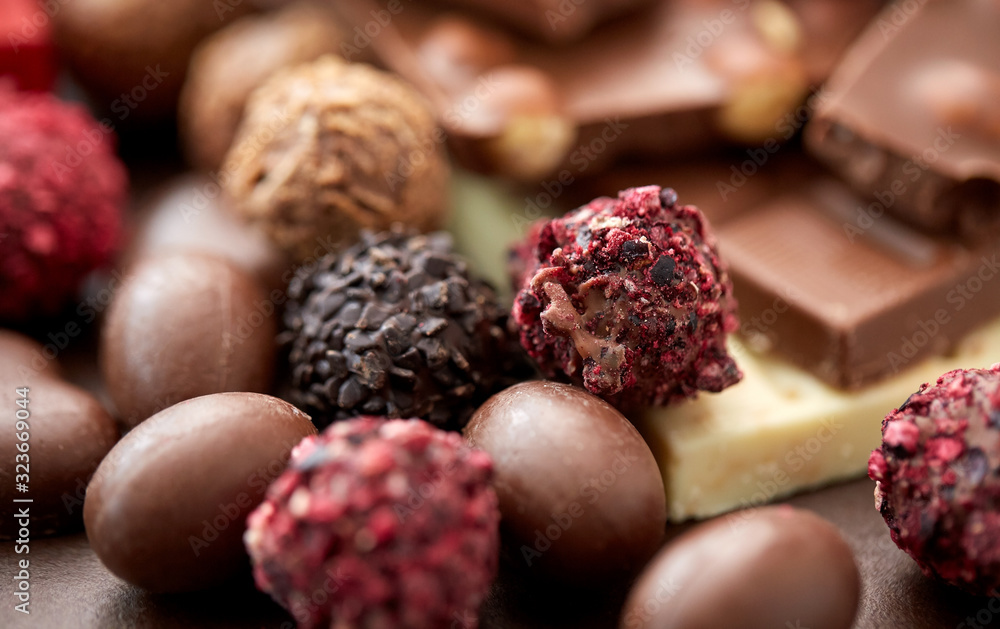 sweets, confectionery and food concept - close up of different chocolate candies sweets, confectionery and food concept - close up of different chocolate candies