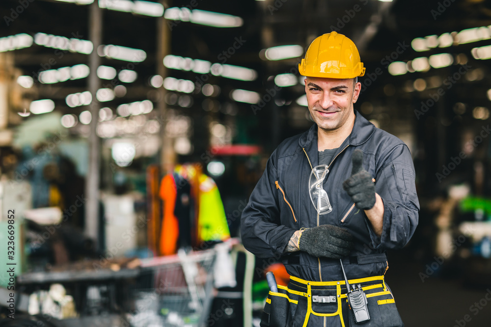 Portrait of foreman labor worker engineer working in industrial factory and waring safty suit happy smile hand show thumb up. Portrait of foreman labor worker engineer working in industrial factory and waring safty suit happy smile hand show thumb up.