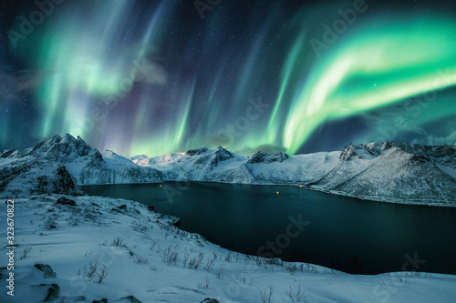 Fotografie Segla peak on Senja island with Aurora Borealis, Northern Lights in winter
