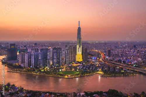 Top view aerial of center Ho Chi Minh City and Saigon bridge with development buildings, transportation, energy power infrastructure. Financial and business centers in  Vietnam. View from District 2 photo