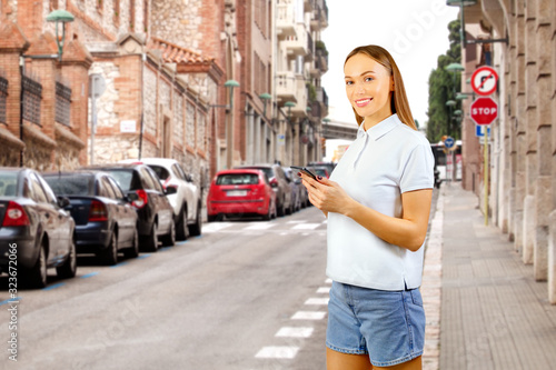 Woman using smartphone in the European city. Travel Vacation Tourist concept.