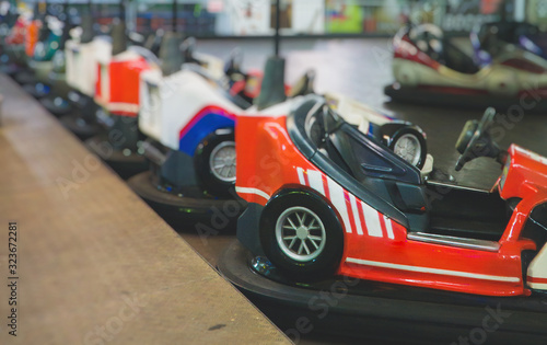 Bumper cars in the city amusement park at evening. © M-Production