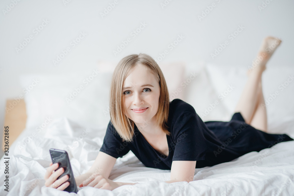 Portrait young mom women uses smart phone for Internet and online chat. Career leave concept, freelance Portrait young mom women uses smart phone for Internet and online chat. Career leave concept, freelance