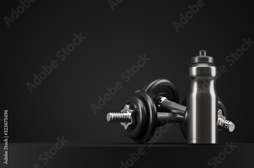 Black fitness bottle and two dumbbells on the black podium with copy space. Sport healthy lifestyle concept.