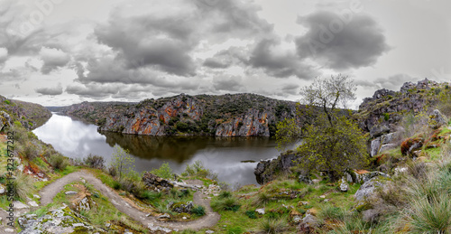 Panoramic view of Cloudy landscape with river and cliffs in Arribes del Duero. Spain. The Arribes del Duero Natural Park.