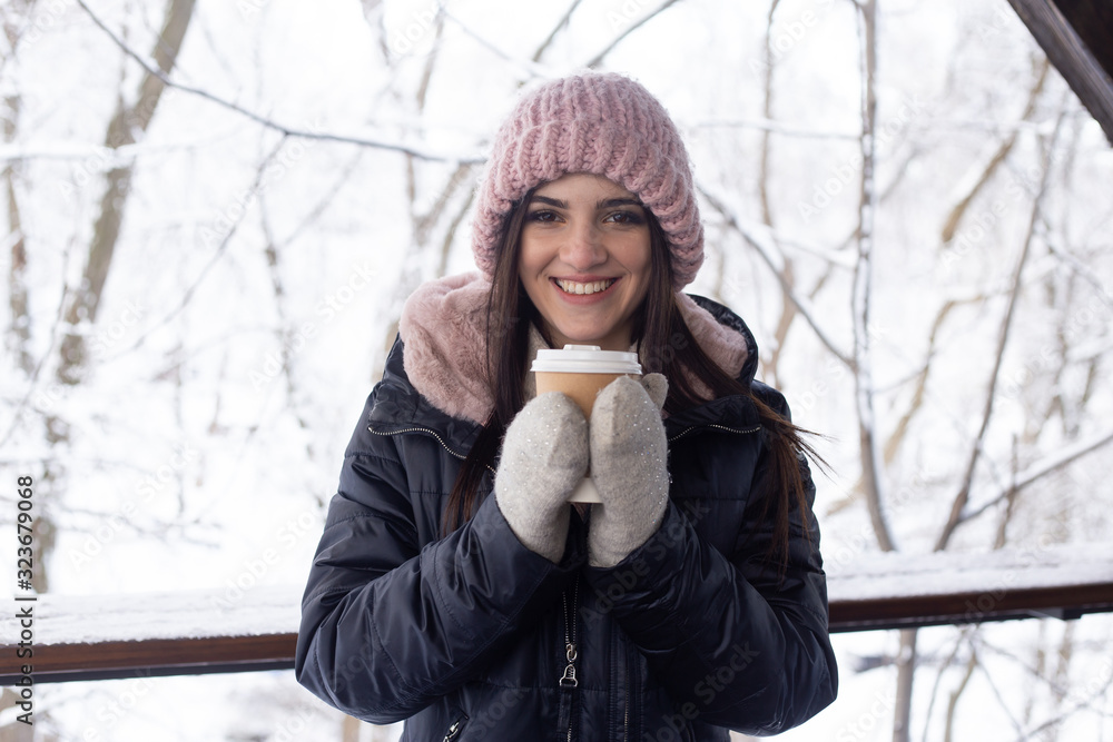 beautiful smiling woman with coffee cup in winter park beautiful smiling woman with coffee cup in winter park