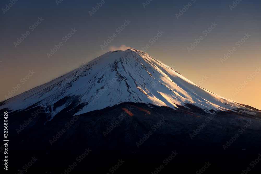 close-up top of Mountain Fuji with snow in the evening.