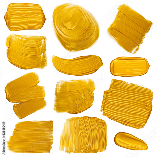 Gold paint brush strokes smugdes set. Golden metallic foil color painted design elements collection isolated on white background.