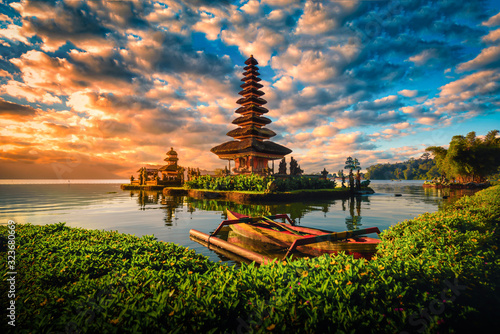 Pura Ulun Danu Bratan, Hindu temple with boat on Bratan lake landscape at sunrise in Bali, Indonesia.