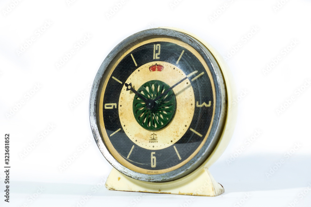 Vintage retro style table clock isolated on a white background.