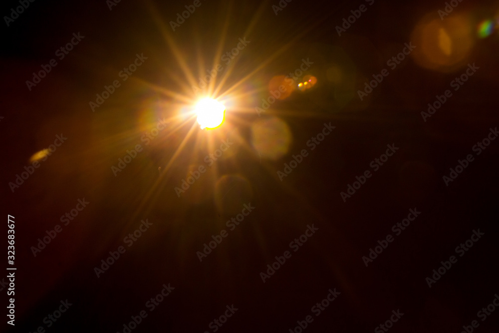 Abstract Natural Sun flare on the black background.