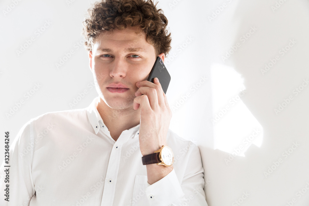 Portrait of a successful young attractive curly haired businessman Portrait of a successful young attractive curly haired businessman
