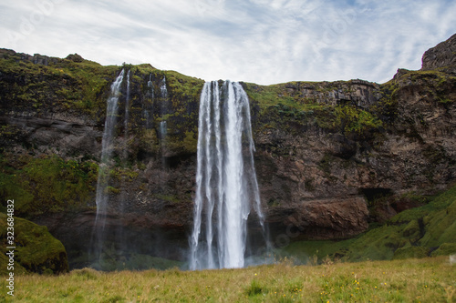 Seljalandsfoss Waterfall in Iceland. It is located near ring road of South Iceland. Majestic and picturesque, it is one of the most photographed breathtaking place of Iceland
