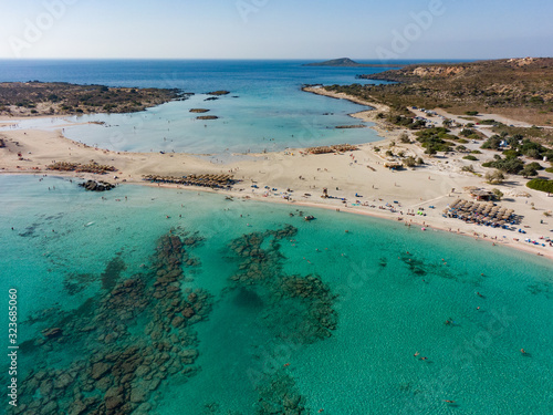 Top view of the Elafonisi beach on the island of Crete in Greece, in the frame is azure water and a recreation area. Aerial photography © Антон Мазаев