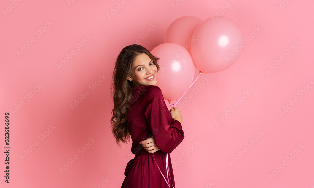 Happy Beautiful Girl Posing With Balloons Over Pink Background In Studio Happy Beautiful Girl Posing With Balloons Over Pink Background In Studio