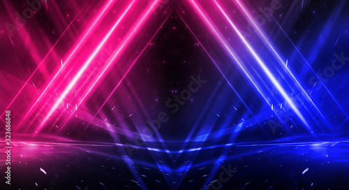 Background of empty stage show. Neon blue and purple light and laser show. Laser futuristic shapes on a dark background. Abstract dark background with neon glow
