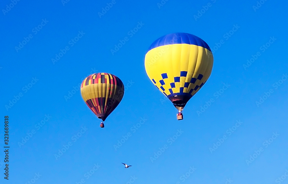 Air balloon on the blue sky background