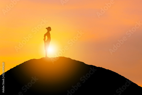 Silhouette of young woman with clipping path practicing yoga relaxing exercise at sunset, Freedom and relax concepts.