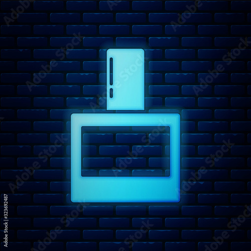 Glowing neon Aftershave icon isolated on brick wall background. Cologne spray icon. Male perfume bottle. Vector Illustration