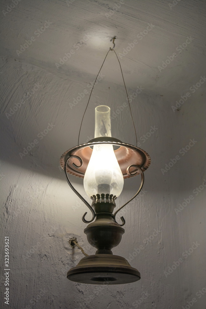 Antique kerosene lamp hanging on the ceiling