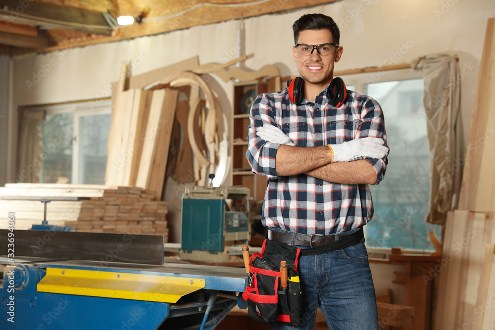 Professional carpenter with set of tools in workshop Professional carpenter with set of tools in workshop