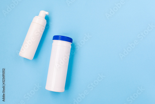 Set of cosmetic plastic bottles. Skin, body care. Branding mockup, top view, flat lay. Beauty treatment concept. Minimalism.