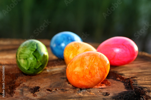 colored painted eggs on the table, easter holiday concept