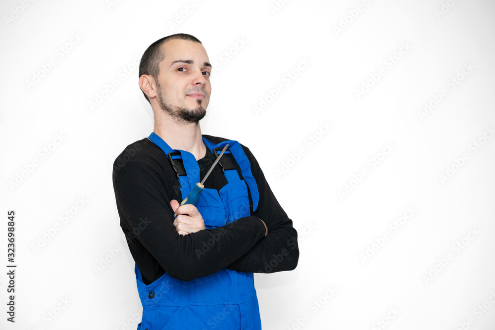 Professional repair, installation and maintenance technician. In a work suit Professional repair, installation and maintenance technician. In a work suit