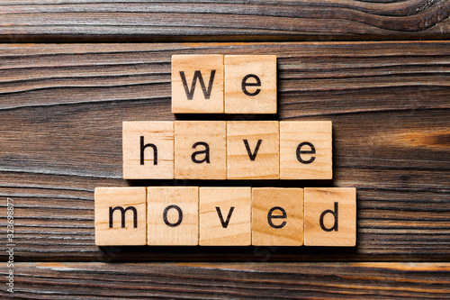 we have moved word written on wood block. we have moved text on wooden table for your desing, concept